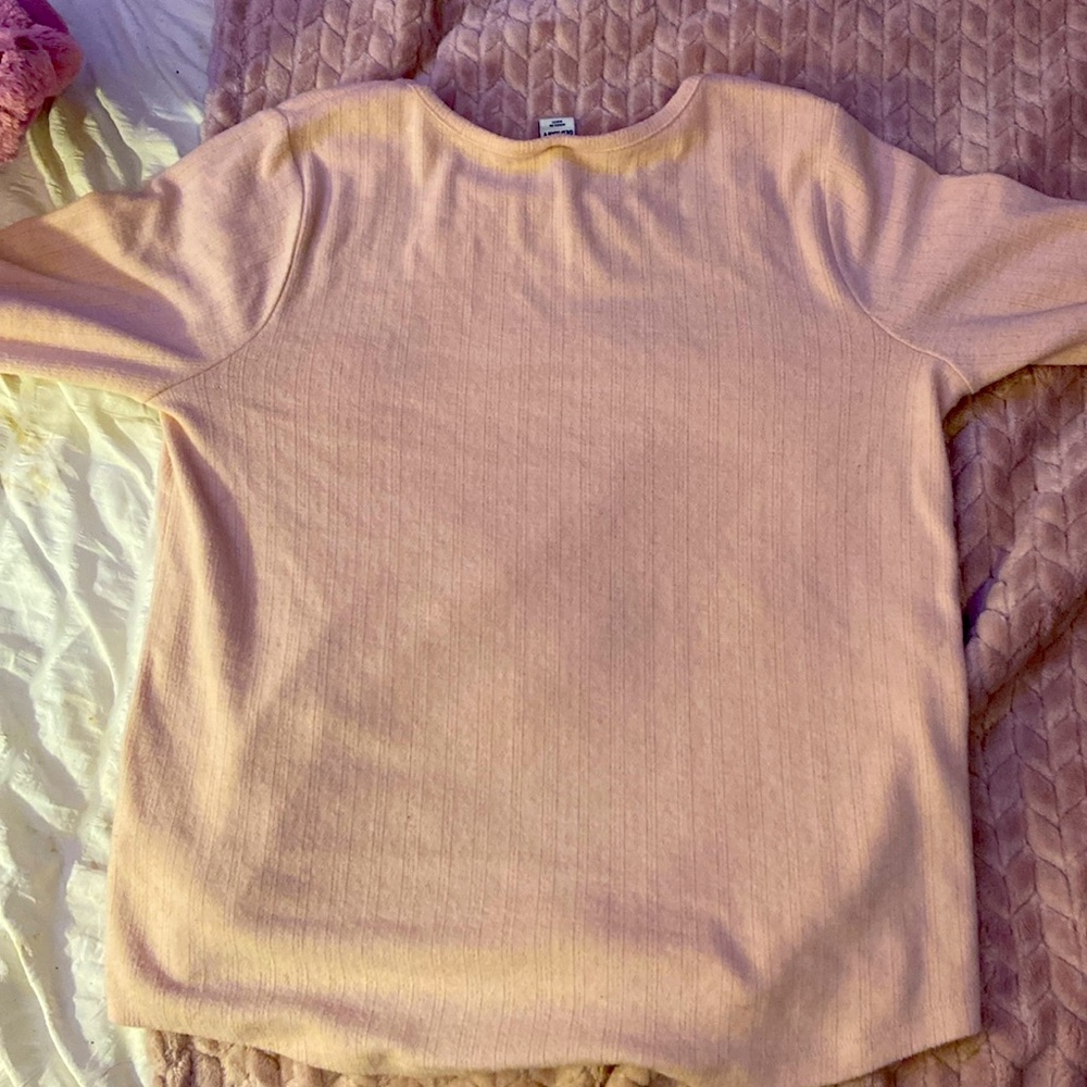 A pink long sleeve shirt